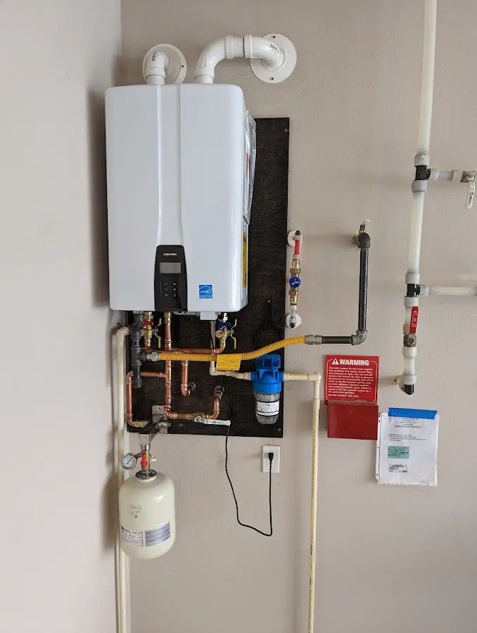 Professional plumber installing copper piping in a Maple Shade home
